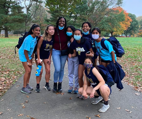 Aastha (top right) and her cross country teammates at a meet this fall