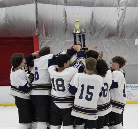 FHSs Ice Hockey Team celebrate their first victory of the 21-22 season
